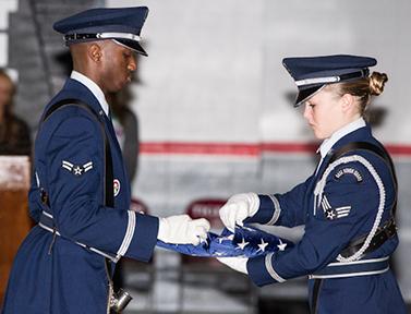 The WAFB Color Guard unfolded the flag, presented it to the audience, then folded it back up before presenting it to Mr. Shipley.