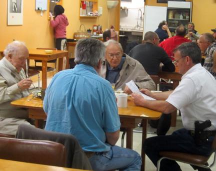 (Photo by Cliff Adams) Sheriff Chuck Heiss, right, meets with local residents for coffee and discussion at Mary Janes Cafe Wednesday morning.