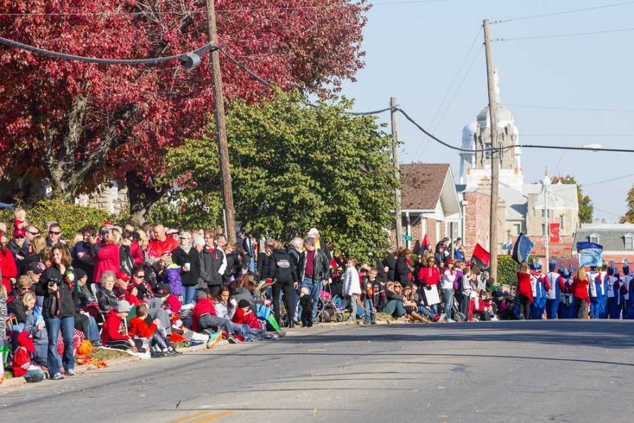 People watch as the parade comes down Holden Street.