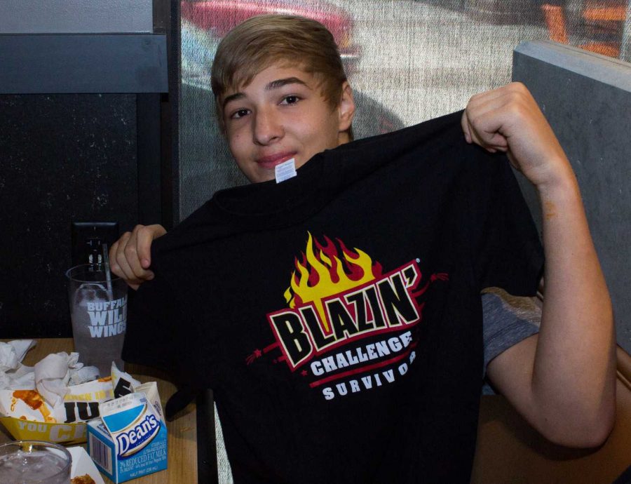 Jordan+shows+off+his+new+shirt+after+completing+the+Blazin+Challenge.