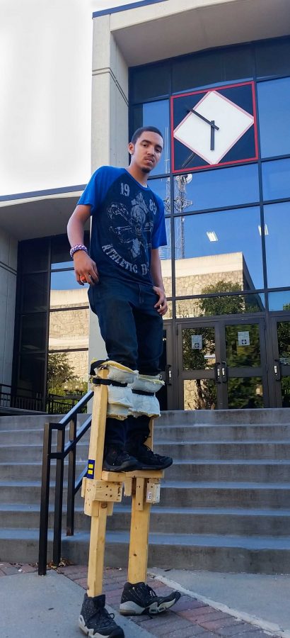 PHOTO BY BRANDON BOWMAN / PHOTO EDITOR
Anthony Portis, freshman construction management major, stands tall in his homemade stilts Tuesday in front of the Elliott Student Union.