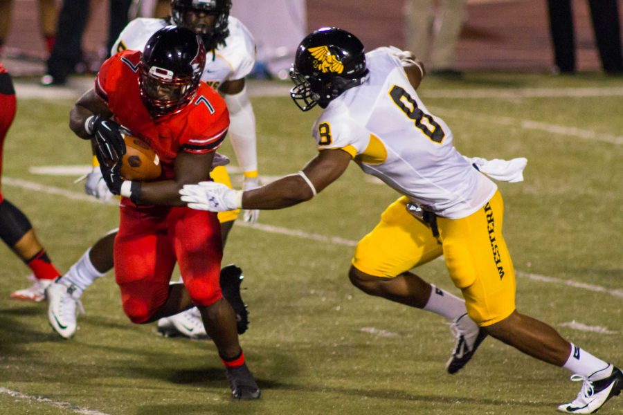 Running back Markel Smith eludes Missouri Western line backer Darrian Bass on his way to positive yards.