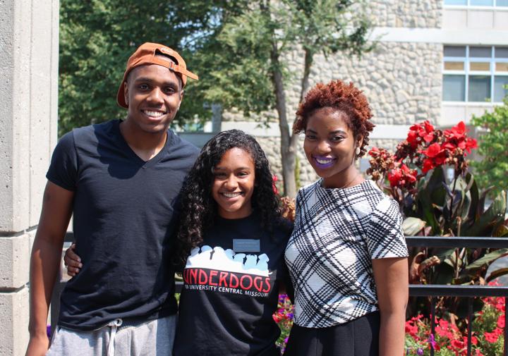 Mentor Coordinator Ramon Henderson, President Lauren Newsome and Vice President Raven Alade pause for a photo outside of the Elliott Student Union.