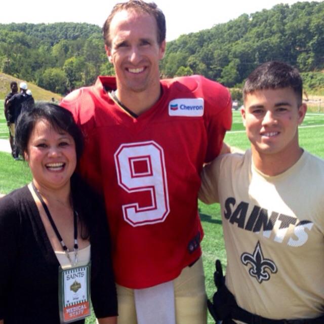 PHOTO VIA MATTHEW GOODS INSTAGRAM ACCOUNT
From left, Norie Good, Drew Brees and Matthew Good pose for a photo at the New Orleans Saints training camp. Matthew interned with the Saints this summer as an athletic trainer.