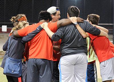 PHOTO BY LIZZIE RIDDER / PHOTOGRAPHER
THRIVE students huddle around each other to commemorate another night of softball at the South Recreation Complex Tuesday night.