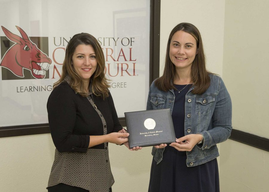 PHOTO SUBMITTED BY UCM PHOTO SERVICES
From left, Kelly Waldram Cramer, interim director of marketing and promotion, presents Marcy Bryant with the 13th Foster/Inglish Award for Outstanding Achievement and Service in Public Relations.