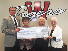 Dr. Scott Patrick, Betty Lockard Brenner class of 1953, Joann Cooper Hanna, class of 1954 and Dorothy Baker Ridge class of 1952. Dr. Patrick accepted on behalf of the
Warrensburg Schools Foundation.