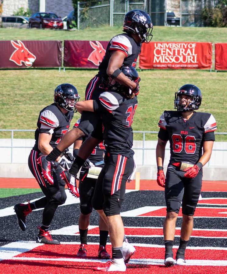 Sophomore+running+back+Koby+Wilkerson+and+sophomore+punter%2Ftight+end+Zach+Davidson+celebrate+Wilkerson%E2%80%99s+touchdown+in+a+61-7+blowout+of+Missouri+Southern+Sept.+29+at+Walton+Stadium%2FKennedy+Field.+The+Mules+host+Nebraska-Kearney+for+homecoming+this+Saturday+with+kickoff+scheduled+for+1+p.m.+at+Walton+Stadium%2FKennedy+Field.+%28Photo+by+Peter+Spexarth%2FFor+the+Muleskinner%29