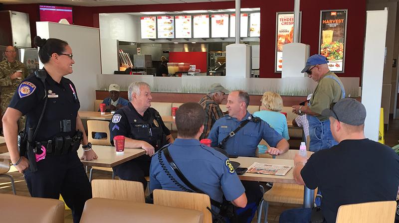 Law+enforcement+offcials+from+UCM+Public+Safety%2C+the+Warrensburg+Police+Department%2C+Missouri+State+Highway+Patrol+and+Whiteman+Air+Force+Base+sit+Wednesday+with+a+community+member+talking+about+different+topics.