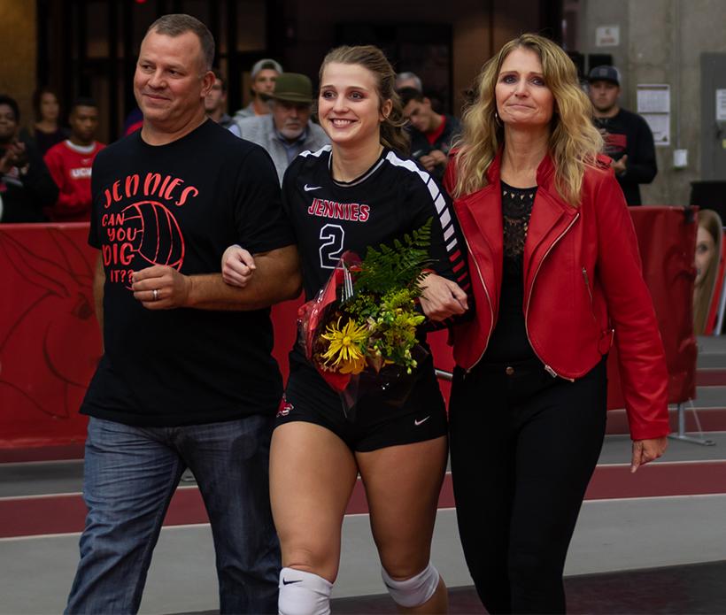 Senior Kylie Hohlen walks with her parents during the Jennies Senior Day pregame ceremony Nov. 3 at the Multipurpose Building. (Photo by Peter Spexarth/For the Muleskinner)