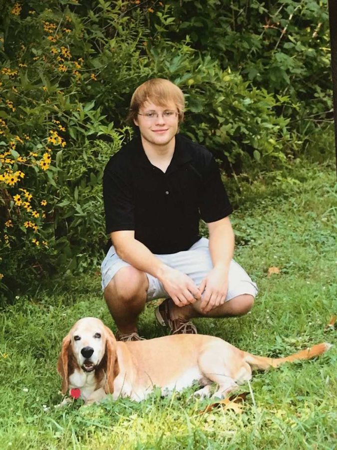 Andrew Pierson poses with his dog at home in Fredericktown,
Missouri. (Photo submitted by Colleen Pierson / For the Muleskinner)