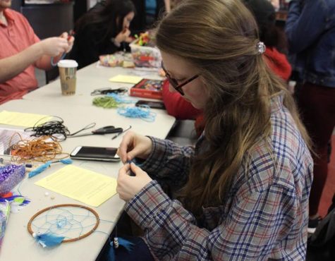 Undergraduate student Marissa Ginger works on her dreamcatcher at the Native American Appreciation event held during Unity Week Feb. 21 at Cafe Rouge in the Elliott Student Union. (Photo by Danielle Friedmeyer/For the Muleskinner)
