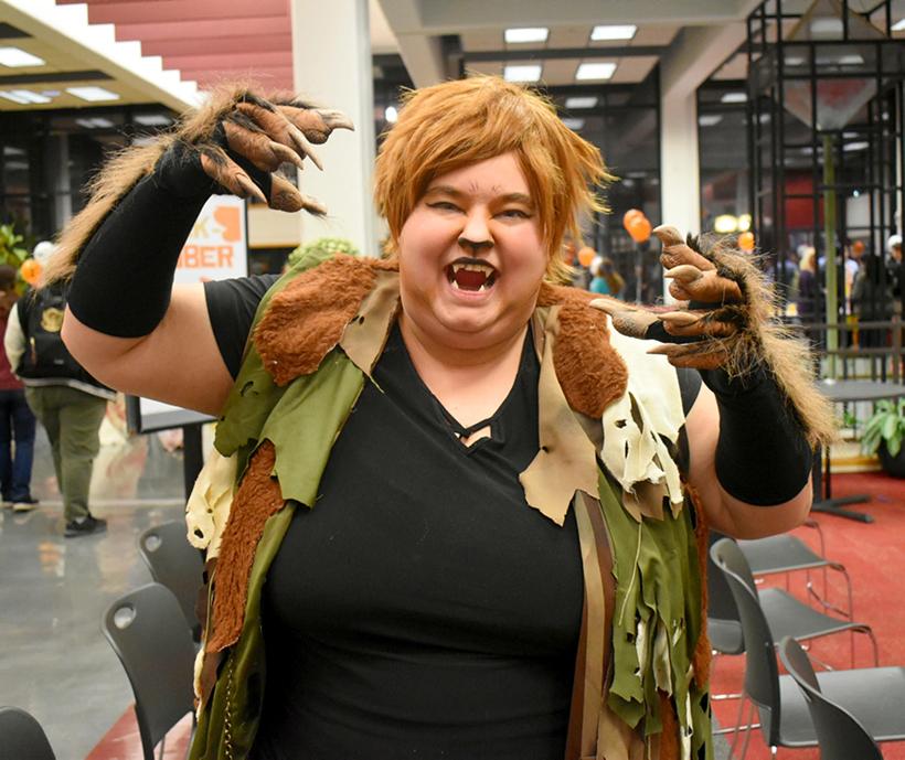 Christina Moore, a senior general studies major, shows off her costume for the Midterm Monster Mash in the Elliott Student Union. (Photo by Katlin Younts)