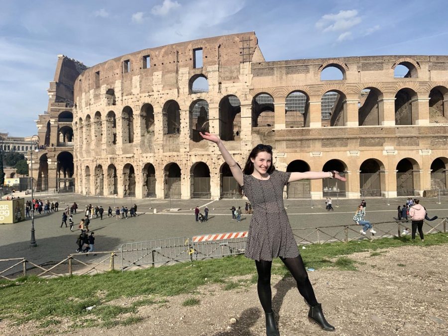 Junior Colleen Wright stands in front of the Colosseum in Rome, Italy. Photo submitted by Colleen Wright