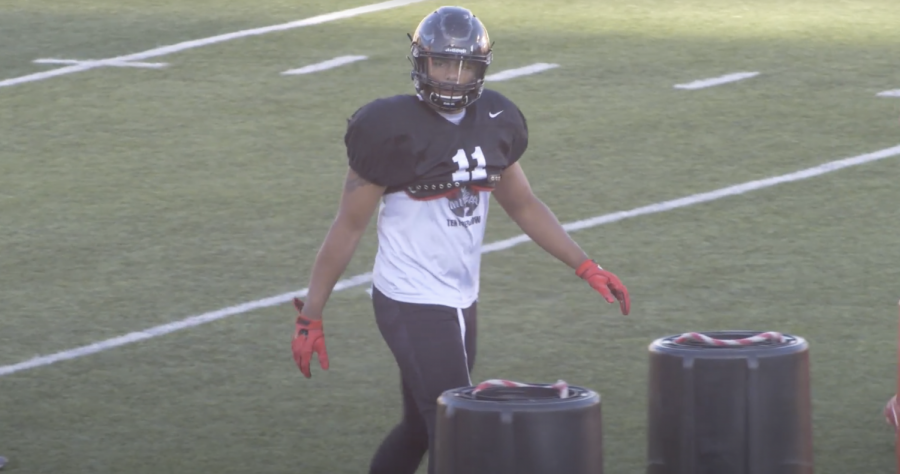 Senior Ubong Udom, physical education major, practicing for the upcoming football season. “Udom was hurt emotionally when the season was postponed. However, he said this will give the team a chance to train together to be a better team.”