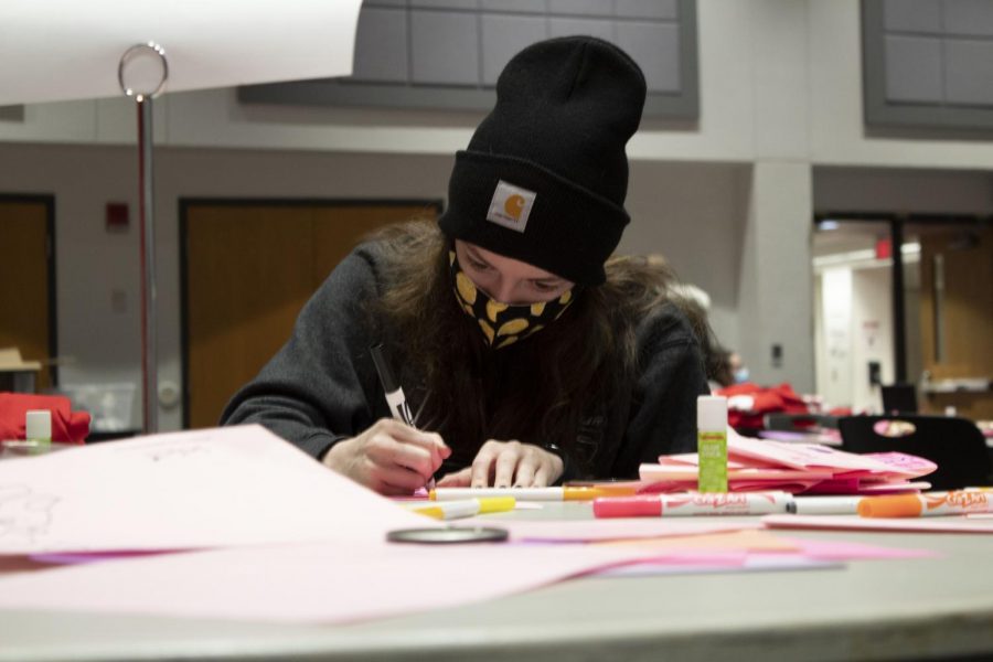 Erin Frazier, sophomore secondary education major, makes Valentine’s Day cards for students in quarantine and for the residents of Ridgecrest Nursing Center. “Specifically for today it’s awesome because one of my sisters was telling us earlier that she was born premature, so she spent a lot of time in the NICU,” Frazier said. “So this is all really impactful for her because she’s able to give back to the NICU nurses and to the kids who are in Children’s Mercy.”