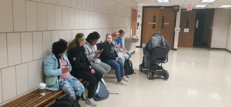 Thrive students Banti Clark, Wendy Cox, Ellen Baskins, Madeline Wallace, Shane Lewis, Seth Davis and Stacy Shelby wait in the hallway outside a classroom for their lessons to begin.