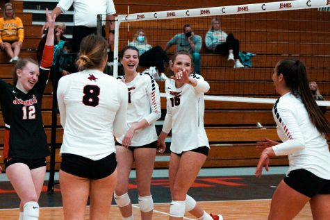 The volleyball team celebrates a point after a rally. The team played against Missouri State University last season. Photo by Graduate Student Brinkley Beever. 