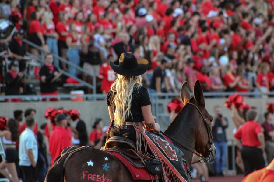 Tori Happy, a UCM Mule Rider, watches over the sea of red for UCMs first home football game of the season. Happy works on UCMs farm, caring for the live mascots to ensure they are ready for campus events. 