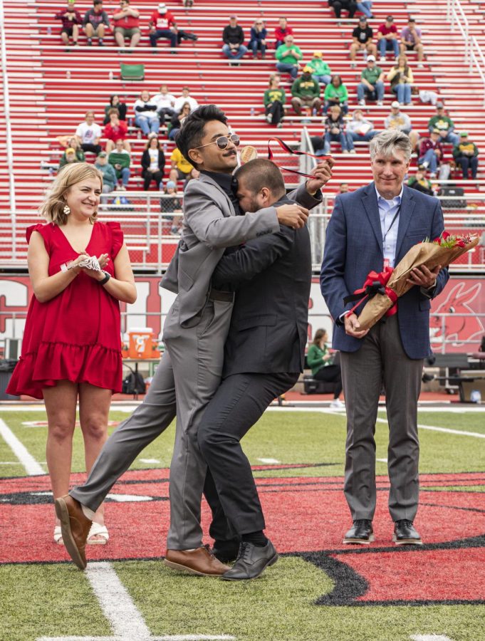 Michael Cadwell wins homecoming king while UCM President Roger Best looks on as he waits to present the next award. Cadwell received the kings medal by 2021 winner Alex Chase