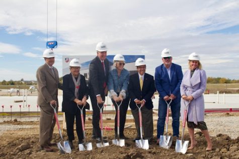 From left, Lynn and Jackie Harmon, Roger Best, Julie Wellner,  Mark Suazo, Dan Houx and Courtney Goddard break ground at the new aviation facility at Max B. Swisher Skyhaven Airport on Oct. 14 which is the location of the new construction.