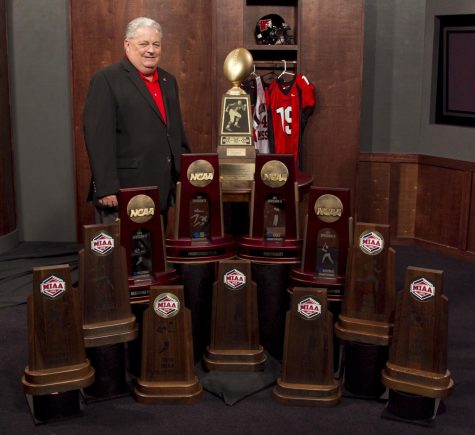 Former Athletic Director Jerry Hughes stands next to a collection
of trophies UCM has earned over his 40 year tenure. Hughes died
on Jan. 21, 2023.