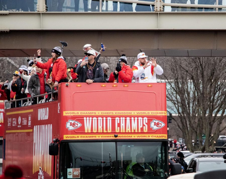 During the Victory Parade on Feb. 15 tight end Travis Kelce enjoys his celebration with the Chiefs fans. Donna Kelce, mother
of Travis, takes photos on her phone to remember this day.
