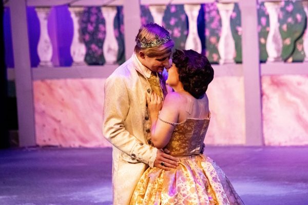 The Theatre and Dance Department putting on a show of Cinderella for this semester’s musical. Mirando Muenz, playing Cinderella and Riley Given, playing Prince Topher, are shown in an intimate moment on stage during their final dress rehearsal.