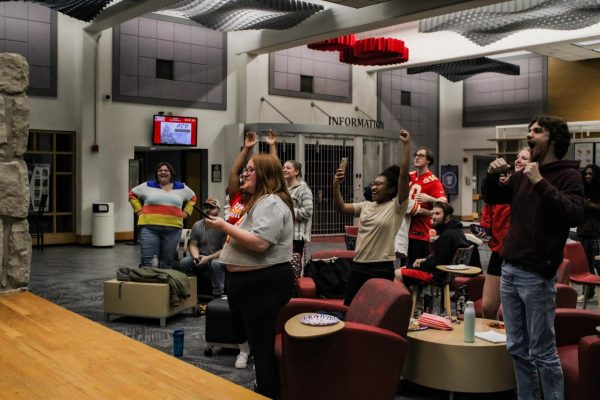 Students cheer as the Kansas City Chiefs score to win the game in overtime during the Super Bowl
LVIII Feb. 11. Students had gathered in the Union to watch the game with free popcorn and pizza.