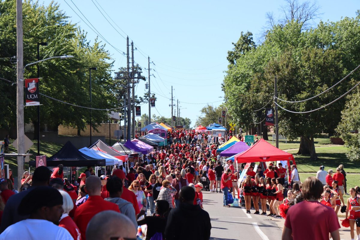 UCM students, along with the Warrensburg community gather on South Holden St. on Sept. 7, 2024 for “Get The Red Out”. Set up on both sides of Holden were booths from local businesses and student organizations wanting to make themselves known to the Warrensburg community. “Get The Red” out happens every year in conjunction with the first UCM Mules football teams home game. Photo by Braeden Sholes