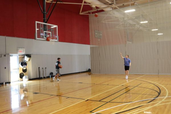 IMG 0079 - Ryan Heidrich and Reeece Troyer take advantage of the basketball courts located in the lower areas of the Student Recreation and Wellness Center between classes. The center is used at all times of day whether by people working out or playing  casual pick-up games on the court. 