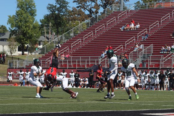 Senior Defensive Back Anthony Wilson dives over a member of the opposing team and attempts to intercept the ball, resulting in Wilson flipping on his head. Despite this incident, Wilson continued playing for the rest of the game with no injuries.