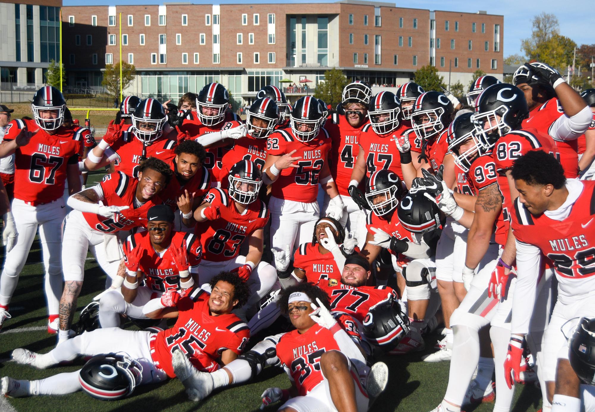 Members of the UCM football team celebrate successfully winning their homecoming game. With this victory, the Mules sit 5-3 overall this season