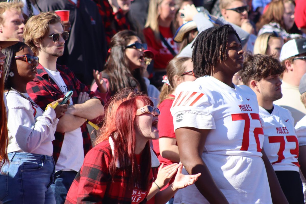 Junior Rae Weber cheers on the Central Missouri Mules toward the end of the first half. The football game took place following the 2024 Homecoming Parade and Party in the Park, all UCM homecoming traditions.