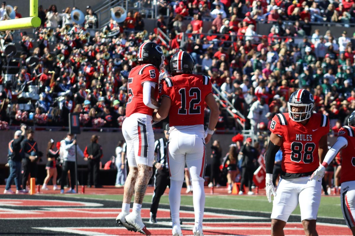 Redshirt Senior Zach Zebrowski celebrating with his teammates after running in a touchdown for the Mules on Oct. 26th at home vs Wasburn. Zebrowski has rushed 2 touchdowns and thrown 29 touchdowns and 3,108 yards this season making him #1 in the country for passing yards.