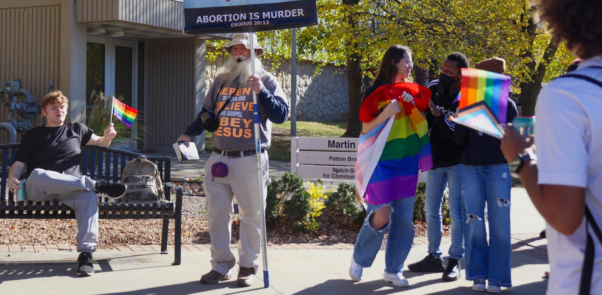 On Nov. 19 at 9:06 a.m., University of Central Missouri students gathered outside of the Union Mall, located on the east side of the Elliot Student Union, to express their opposing views to demonstrator Jeffrey Mullen. Many students brought LGBTQ+ flags to the scene to show support for the LGBTQ+ community. 