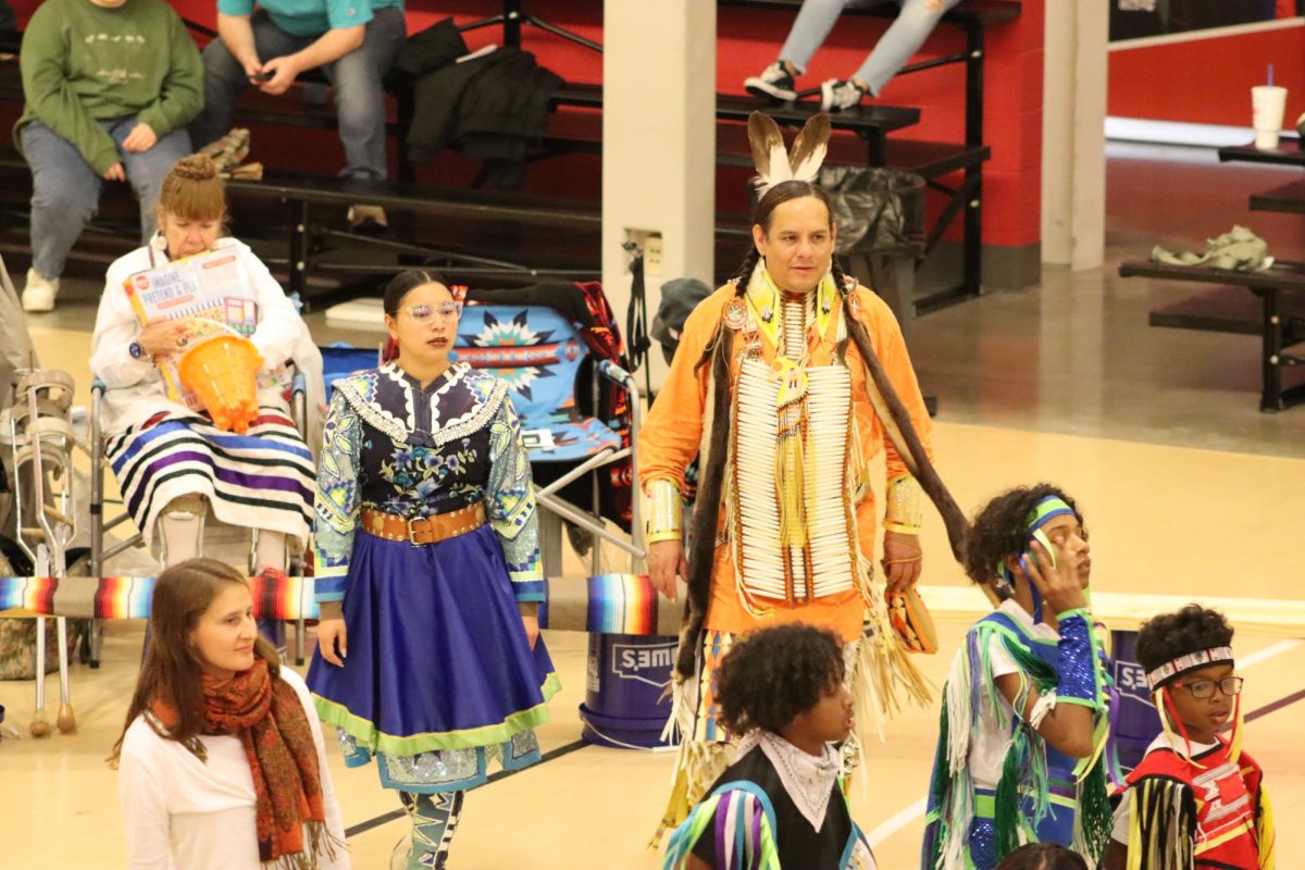 Native American dancers dressed in tribal regalia participate in the Gourd Dance. The Trading Moon Powwow was hosted on Nov. 9 at the Student Recreation and Wellness Center and was open to students and members of the public. 