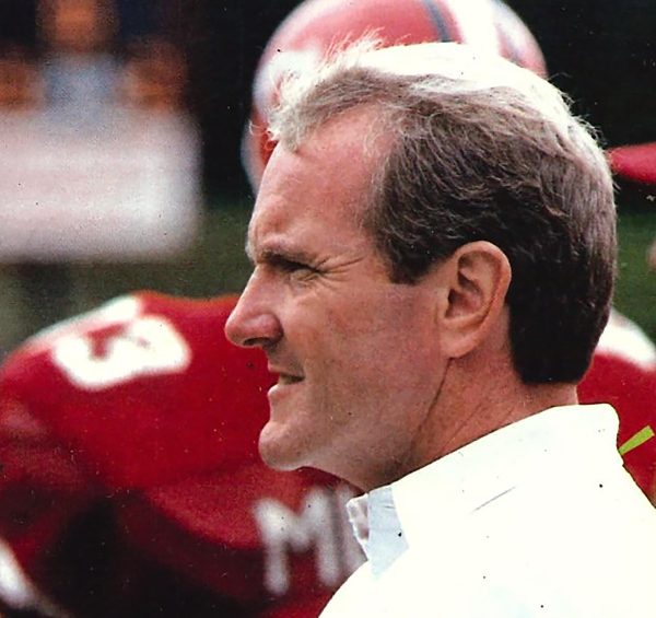 Former Mules Football Head Coach Terry Noland looks on as his team celebrates becoming the Mid-America Intercollegiate Athletics Association Champions after defeating Lincoln 56-9. During his 13-year career, Noland led the Mules to four MIAA championships. Submitted by UCM McClure Archives. 