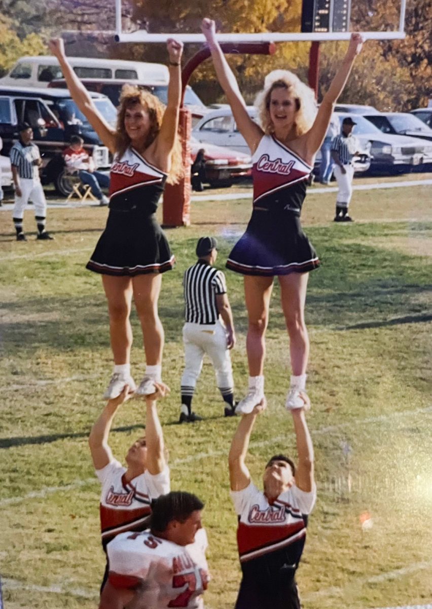 Former Mules cheerleader Tracy Palmer (top left) entertains the crowd during a Mules Football game. Palmer enjoyed cheerleading during high school and joined the Mules Cheer Team during the basketball season her freshman year at UCM. Photo Submitted by Tracy Palmer
