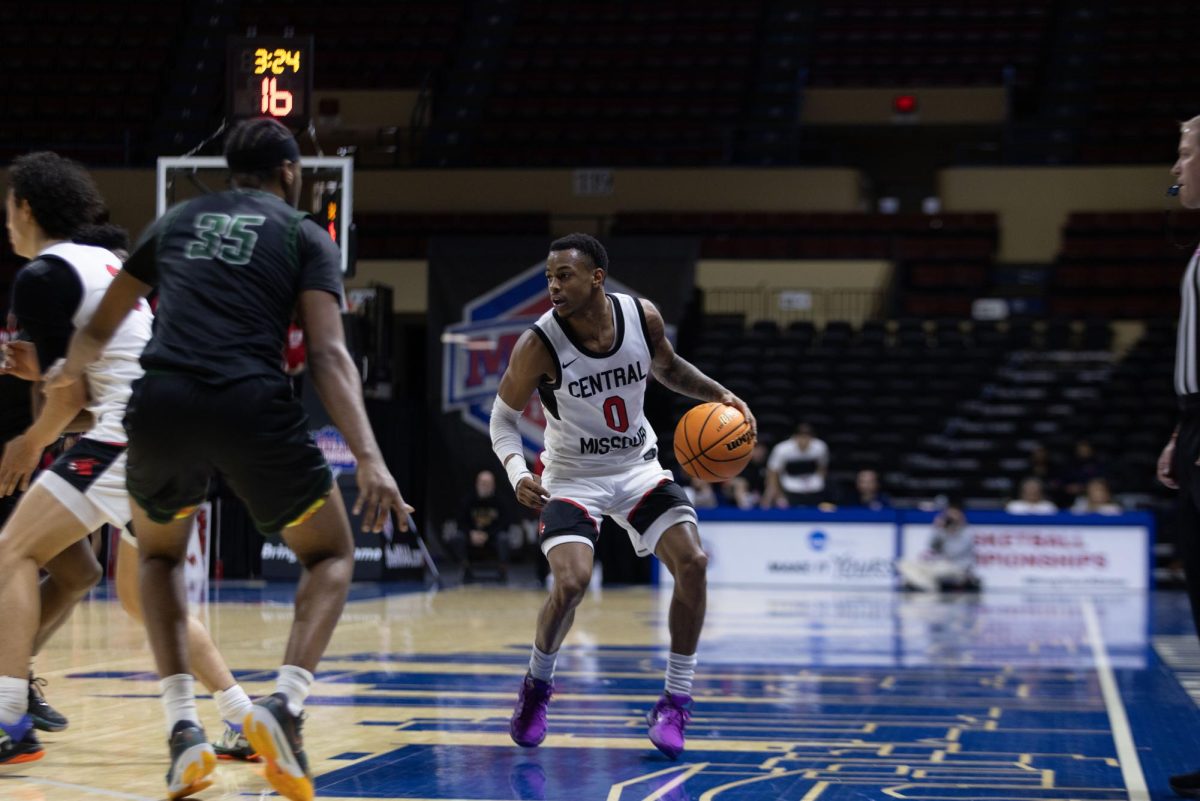 Mules guard DeAirius Barker takes on a Northeastern State Defender in Municipal Auditorium on Wednesday March 5th. He would lead UCM in scoring going into the half with 19 points