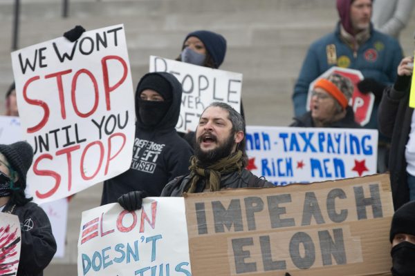 Concerned Missouri citizens gather on the steps of the Missouri State Capitol on Feb. 5 with homemade signs to display their desire for political change. Over the course of the protest, many
people brought and traded signs to display their beliefs.