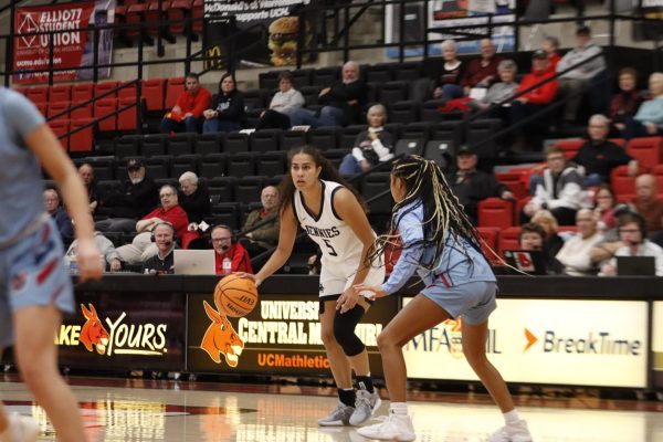 Junior guard Akaysha Muggeridge prepares to pass the ball down the court to aid in the Jennies’ 85-72 victory over the Washburn Ichabods. During the Dec. 21 game at the Jerry M. Hughes Athletic Center, the Jennies went into the second half tied 35-35, where they would gain 50 points, leading to a victory.