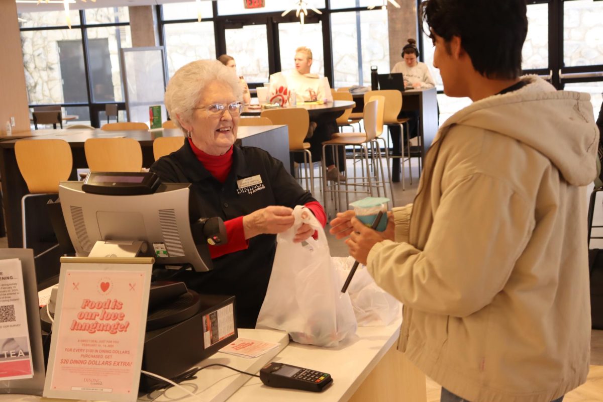 Sodexo employee Darlene Simpson engages with a student at The Grid, a convenience store located at the bottom of the Elliott Student Union. Simpson has been serving the UCM community for over 20 years.