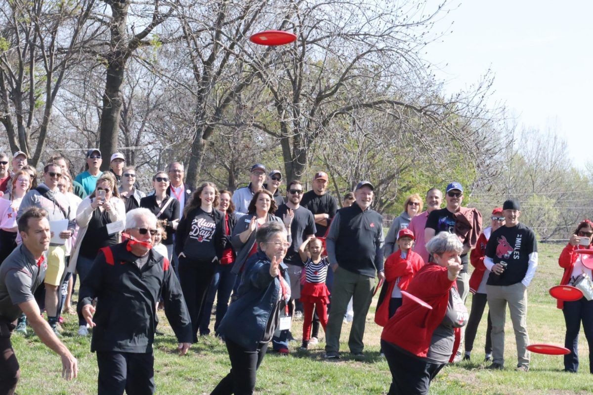 University of Central Missouri alumni, volunteers, project coordinators and community members throw frisbee discs at the opening of the Blaine Whitworth Disc Golf Course. The event was on April 12 and was open to the public. 