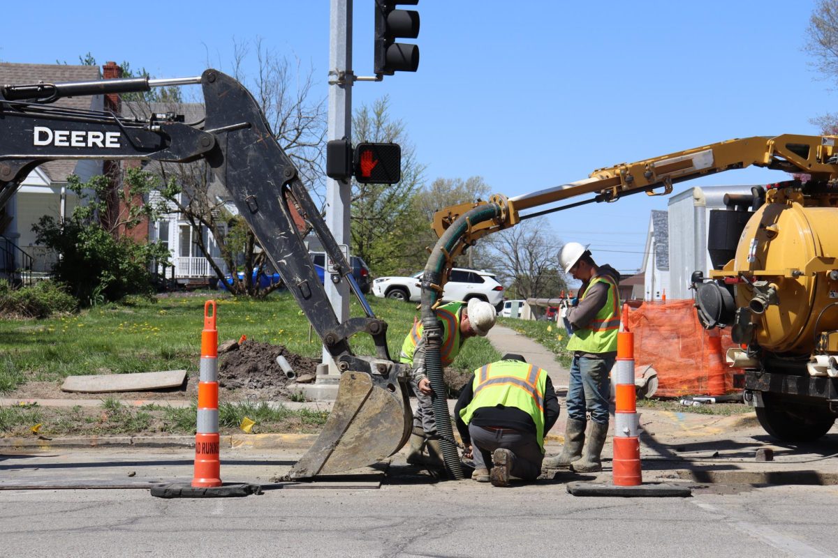 Construction workers update utility infrastructure along Maguire Street. The construction of utility infrastructure began in late 2024 and includes updates to water, gas and sewage utilities.