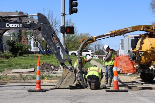Construction workers update utility infrastructure along Maguire Street. The construction of utility infrastructure began in late 2024 and includes updates to water, gas and sewage utilities.