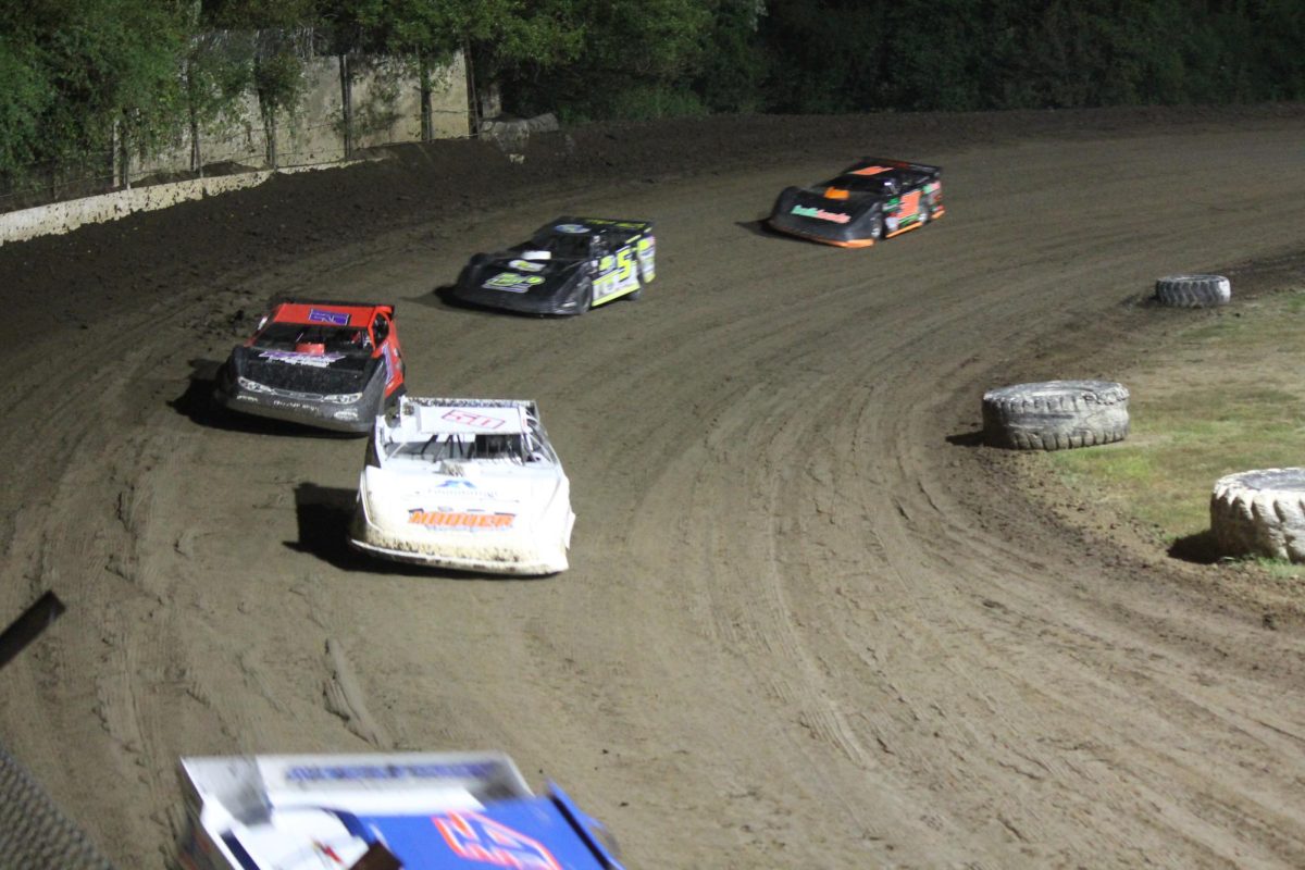 Racers speed through a turn at Central Missouri Speedway on Sept. 13. The track, which is currently listed for sale, is three-eighths of a mile and composed of clay.