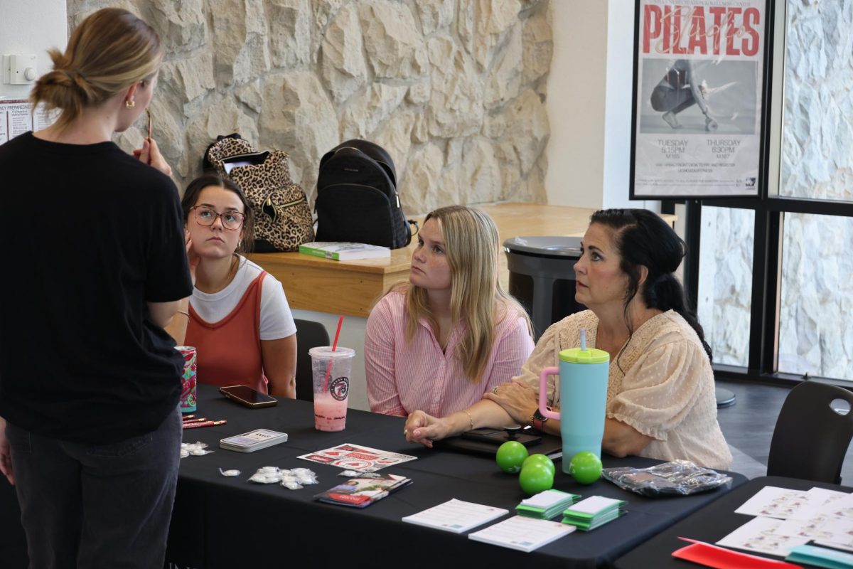 Students inquire about mental health resources at the Mo Cares Resource Fair on Sept. 3 in the Elliot Student Union. The fair hosted many different mental health-related organizations, including the University of Central Missouri Counseling Center, the UCM Marriage and Family Therapy Clinic and Compass Health.