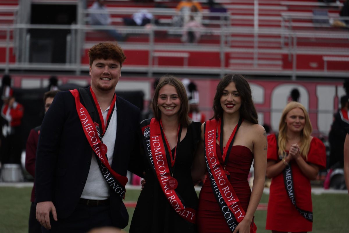 The 2025 UCM homecoming royalty winners, senior Danniel Casey, junior Emily Keck and junior Hannah Stevens, smile for a photo during the homecoming football game against Emporia State at the Audrey J. Walton Stadium. The final winners were chosen from ten finalists at halftime.