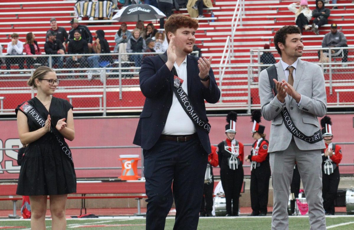Senior Danniel Casey smiles and steps forward after his name is announced for homecoming royalty. Casey represented the Sigma Tau Gamma fraternity. 